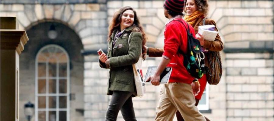 Students chatting whilst walking past Teviot