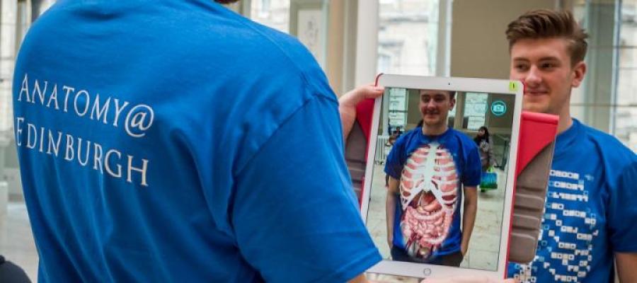 Volunteers at the Science Saturday event at the Museum demonstrating the anatomy app on the Ipad