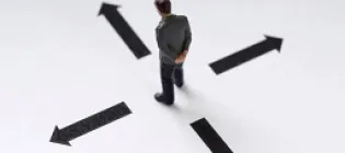 An image of a person looking at arrows on the floor