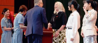 Prof Welburn receiving her award