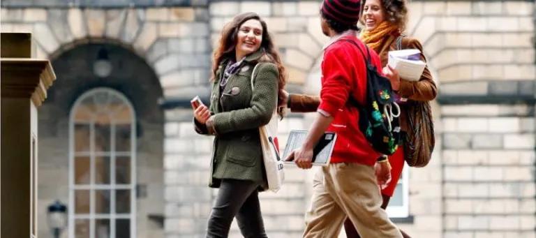 Students chatting whilst walking past Teviot