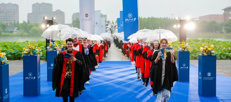 The student hosts leading the student procession at their graduation celebration 2026