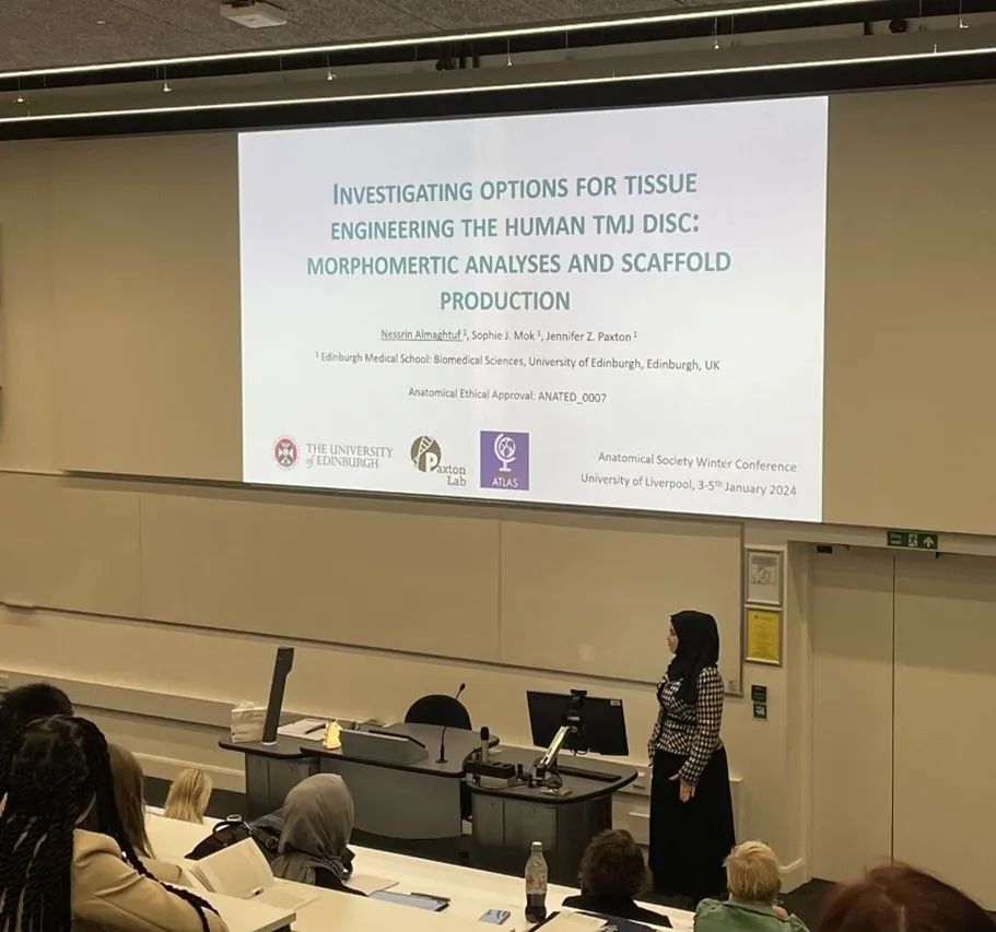 An image of Nessrin presenting her topic