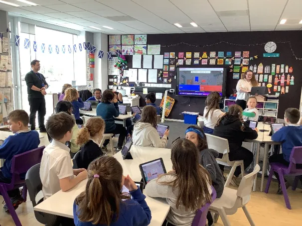 School pupils learning about bones of the upper limb