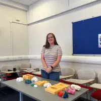 Ellie Horne with her two-part silicone mould that could be used to create plaster hemisphere models showing both the internal and external structures of the brain. 