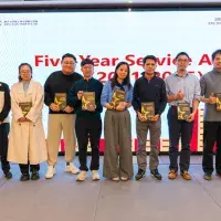 A photo of the five year winners at the new year event