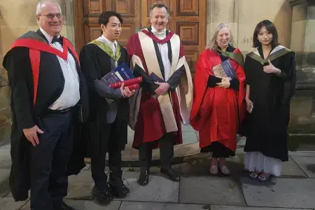 A group photo of masters graduates Gege Wang and Haolie Fang with Profs Shipston, Welburn and Le Tissier standing outside McEwan Hall after graduation