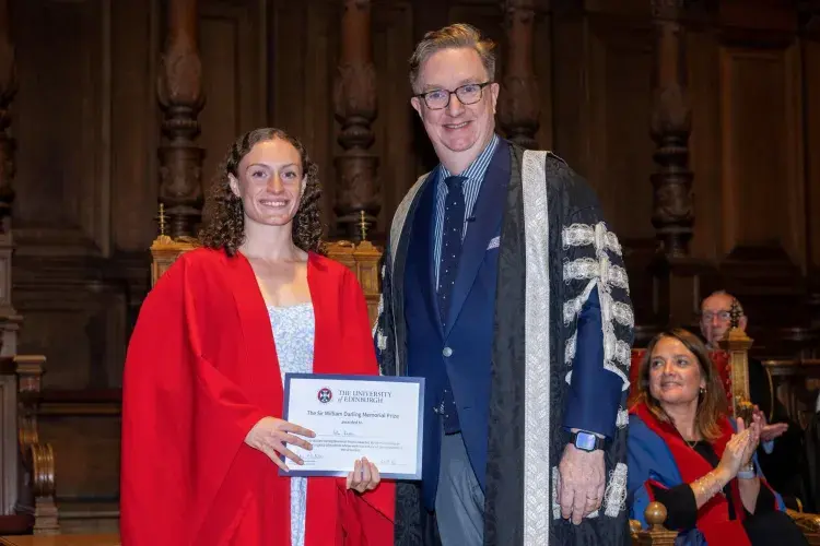 Isla Britton (left) standing with Professor Colm Harmon, Vice-Principal Students