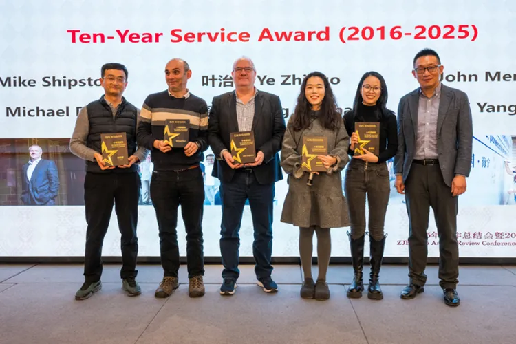 A photo of the 10 year winners at the new year event