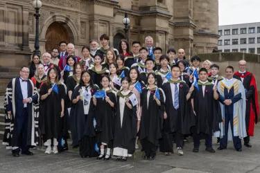 ZJE graduating students and staff stand outside the McEwan Hall with Profs David Argyle and David Kluth