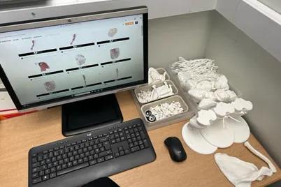 3D models next to computer set up