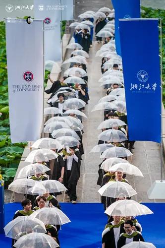 ZJE students lining up on the campus bridge ready to process for their graduation celebration.