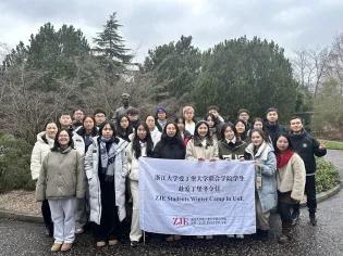 A photo of the ZJE UG students next to a statue of Dr Wong Fun