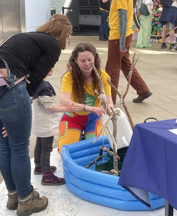 A photo of Roo setting up the tippy tap station