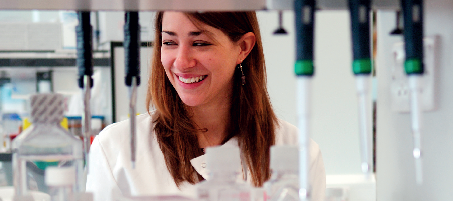 A woman in a lab with shelves