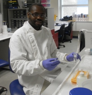 Dennis Muhanguzi doing lab work