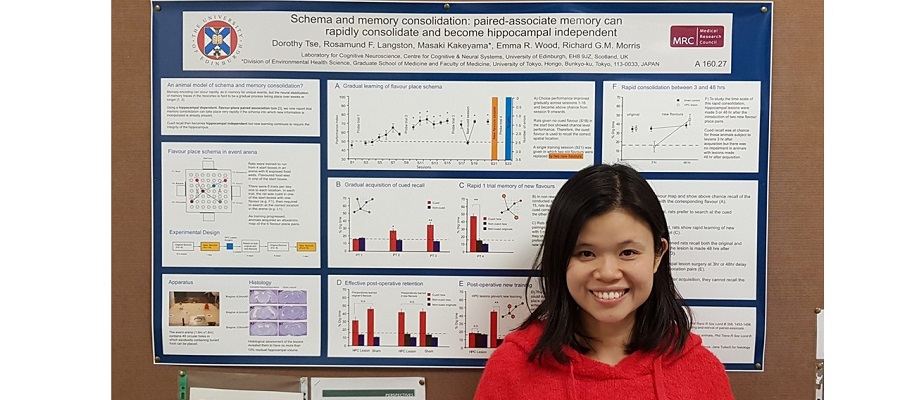 Dr Dorothy Tse standing beside her poster