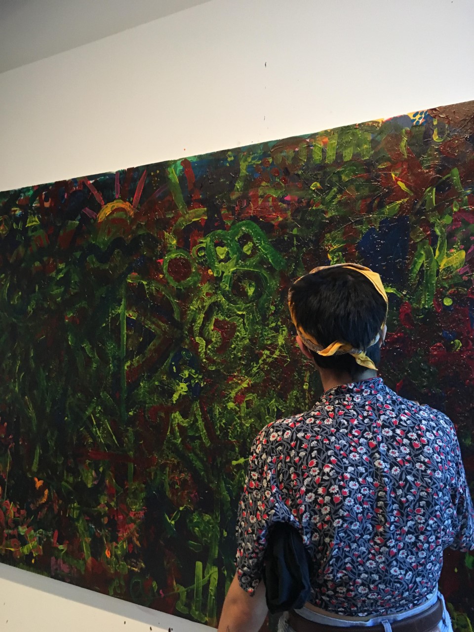 A photo of Jessica Cox viewing a painting in Montreal