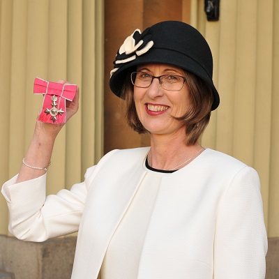 Dr Jane Haley receiving her MBE at Buckingham Palace