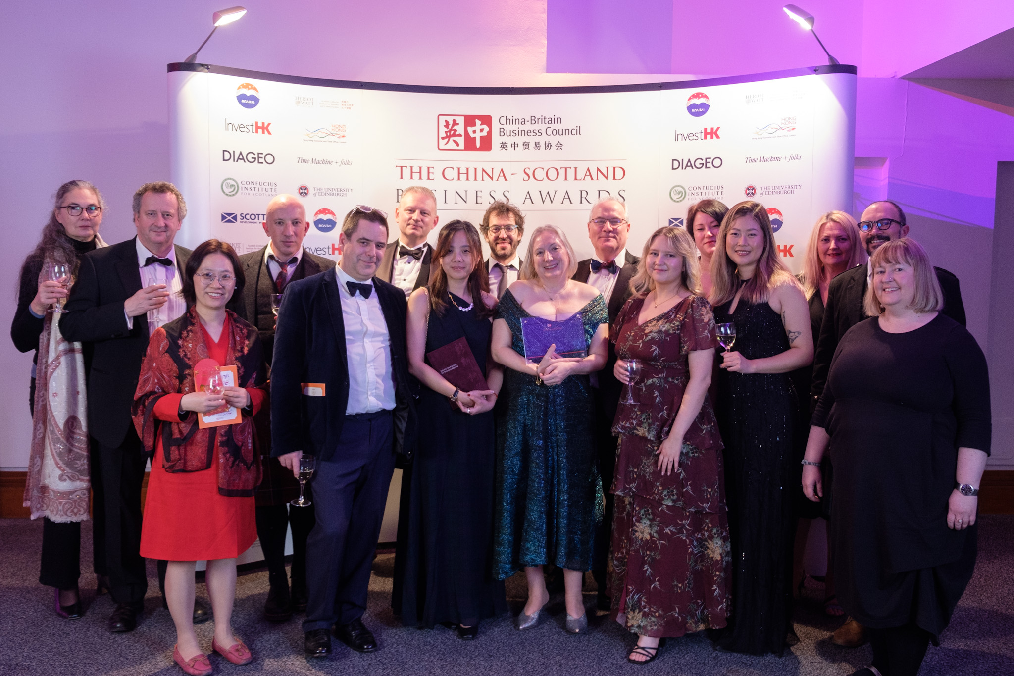 Image of the winning team at the China-Scotland Business awards. Edinburgh colleagues on the podium holding the award